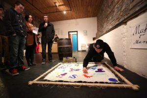 Darren Wilson contributes to “Make Your Mark” by Barbara Schmaucks at the launch of Live Art Week by Performing Arts students at IT Sligo, in the Factory Performance Space, Sligo. Photo: James Connolly / PicSell8.